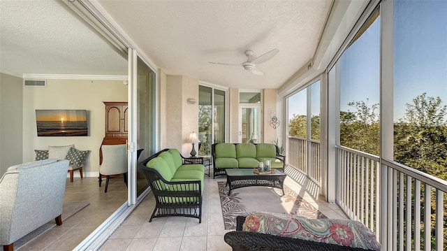 sunroom featuring ceiling fan