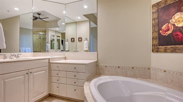 bathroom with vanity, shower with separate bathtub, and ceiling fan