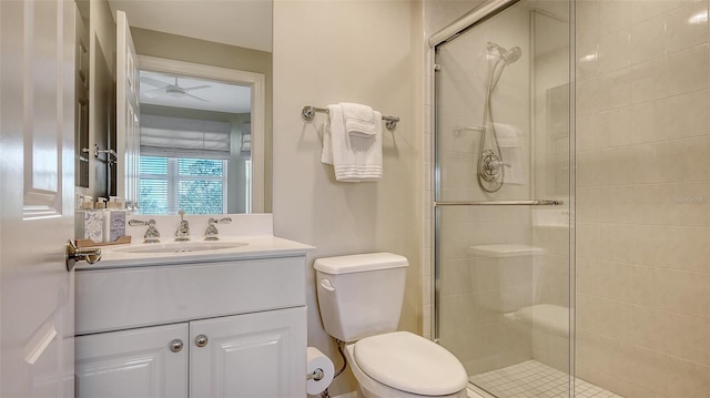 bathroom with toilet, vanity, and walk in shower