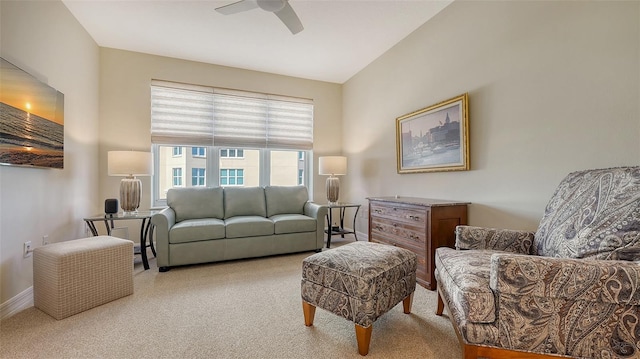 living room featuring light carpet and ceiling fan