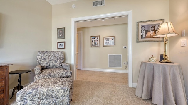 living area with light carpet