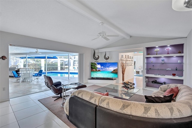 tiled living room with vaulted ceiling with beams, ceiling fan, and built in shelves