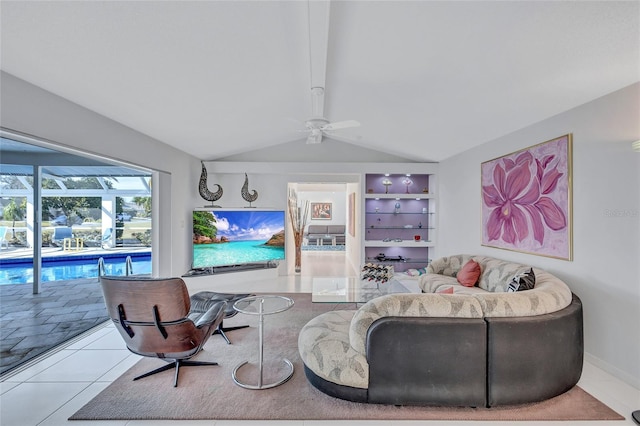 living room featuring vaulted ceiling, ceiling fan, and light tile patterned flooring