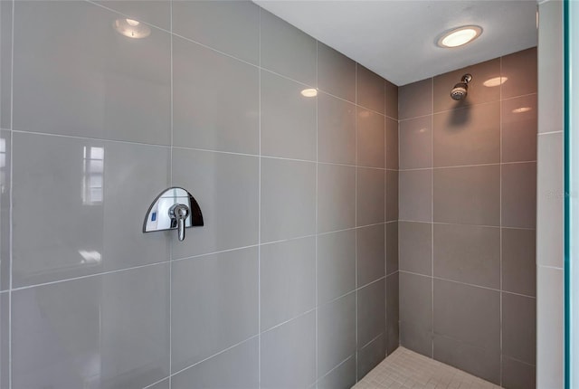 bathroom with a tile shower