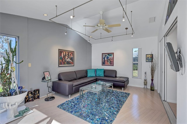 living room with rail lighting, high vaulted ceiling, and ceiling fan