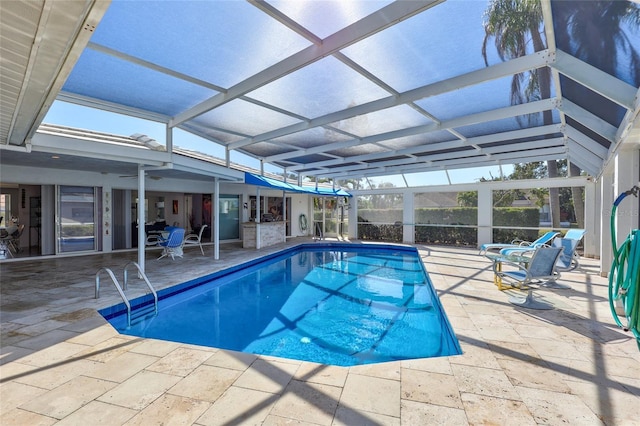 view of pool featuring a lanai and a patio