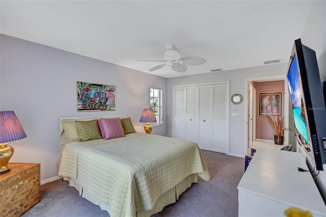 carpeted bedroom featuring ceiling fan and a closet