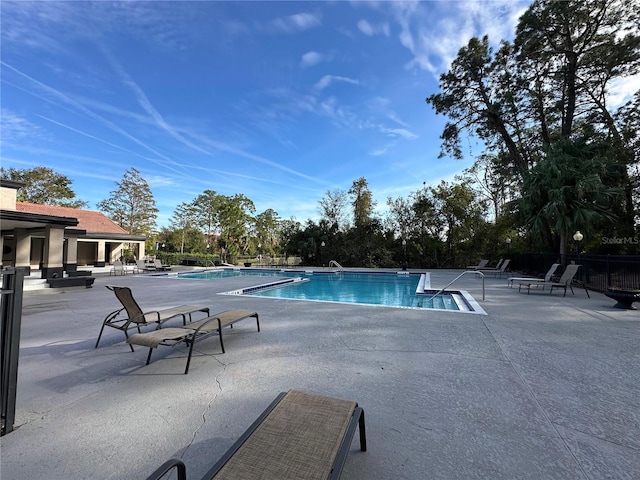 view of pool featuring a patio