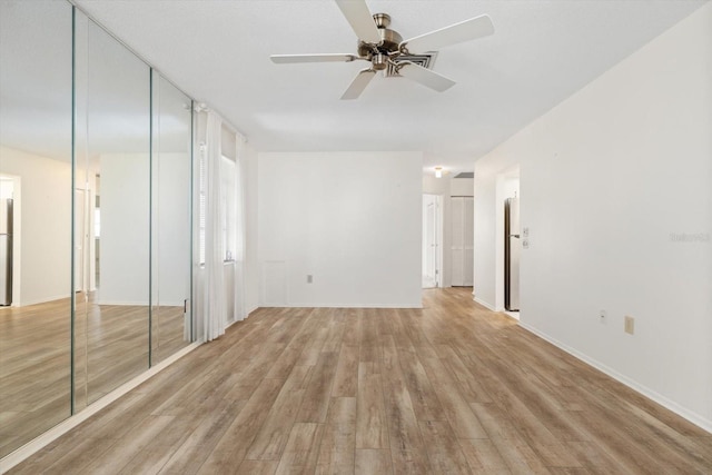 interior space featuring ceiling fan and light hardwood / wood-style floors