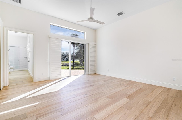 spare room featuring light hardwood / wood-style floors and ceiling fan