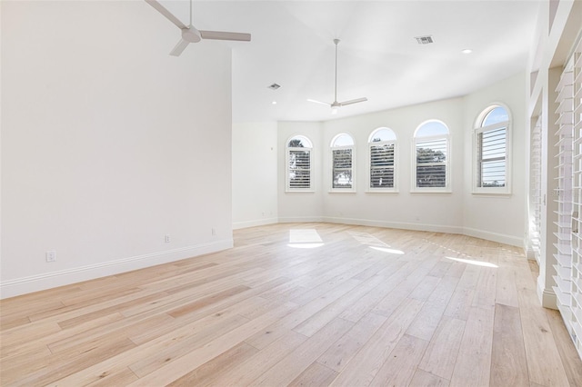 unfurnished room featuring ceiling fan and light wood-type flooring