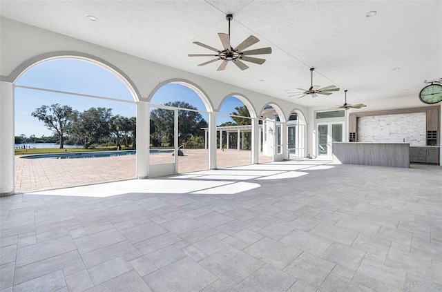 view of patio / terrace featuring ceiling fan