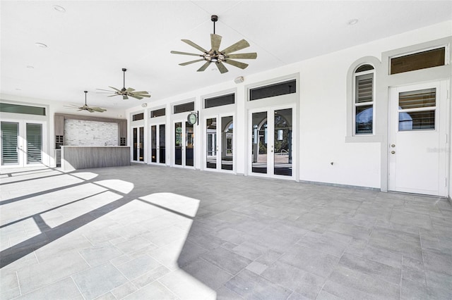 view of patio / terrace featuring french doors and ceiling fan