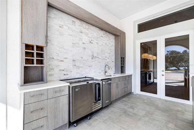 kitchen featuring french doors and sink