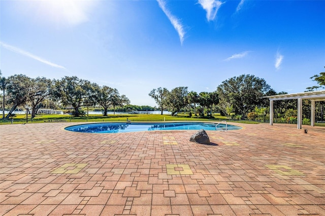 view of swimming pool featuring a pergola and a patio area