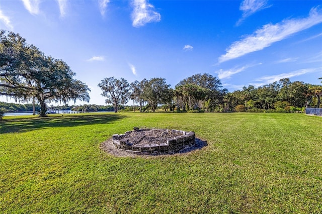 view of yard with a fire pit