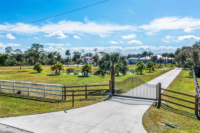 exterior space with a water view and a yard