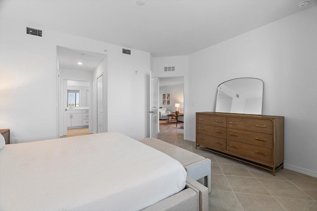 tiled bedroom with ensuite bathroom