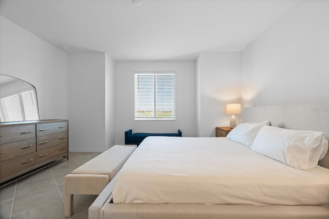 bedroom featuring light tile patterned flooring