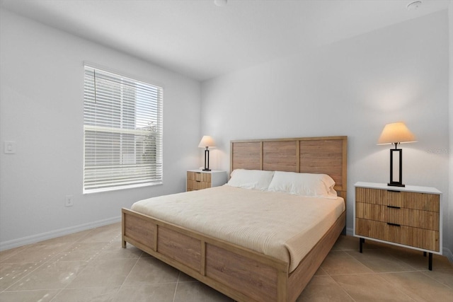 bedroom featuring light tile patterned floors