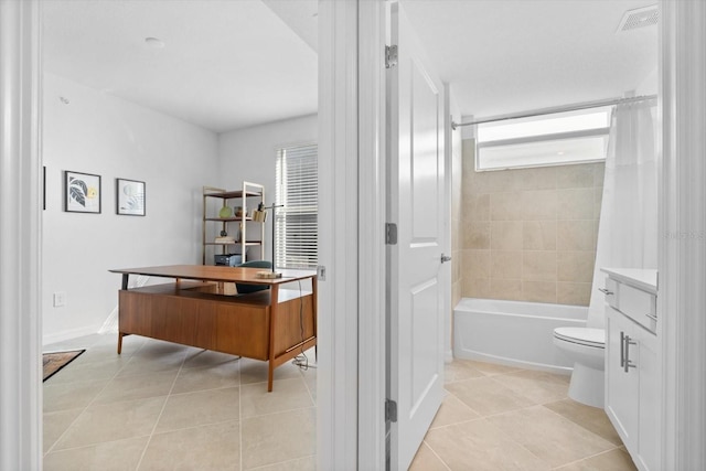 full bathroom featuring tile patterned flooring, vanity, shower / tub combo with curtain, and toilet