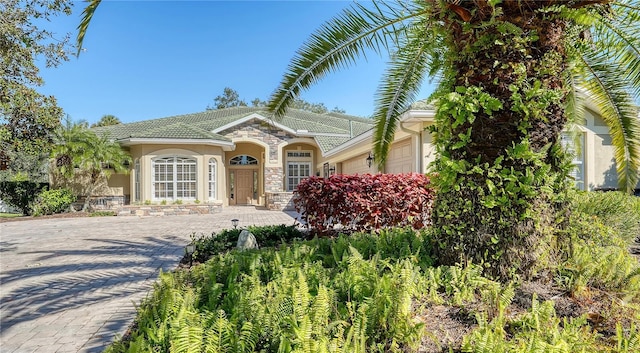 mediterranean / spanish house featuring a garage