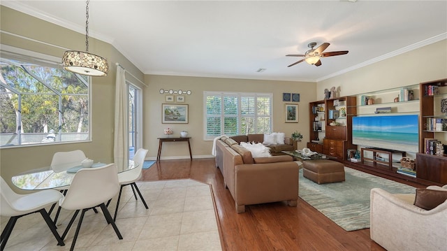 12471 Natureview Cir, Bradenton, FL 34212 - living room featuring ornamental molding, ceiling fan, wood finished floors, and baseboards