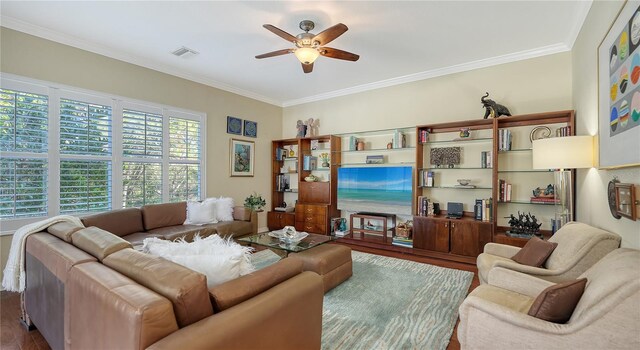 12471 Natureview Cir, Bradenton, FL 34212 - living area featuring ceiling fan, wood finished floors, and ornamental molding