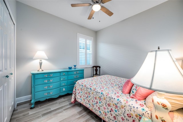 bedroom featuring vaulted ceiling, ceiling fan, and a closet