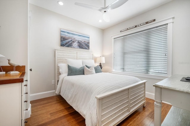 bedroom with ceiling fan and dark hardwood / wood-style flooring