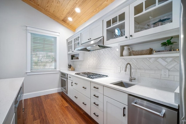 kitchen with sink, wood ceiling, vaulted ceiling, stainless steel appliances, and white cabinets