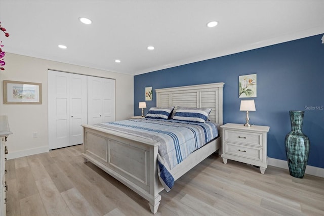 bedroom featuring light hardwood / wood-style floors and a closet