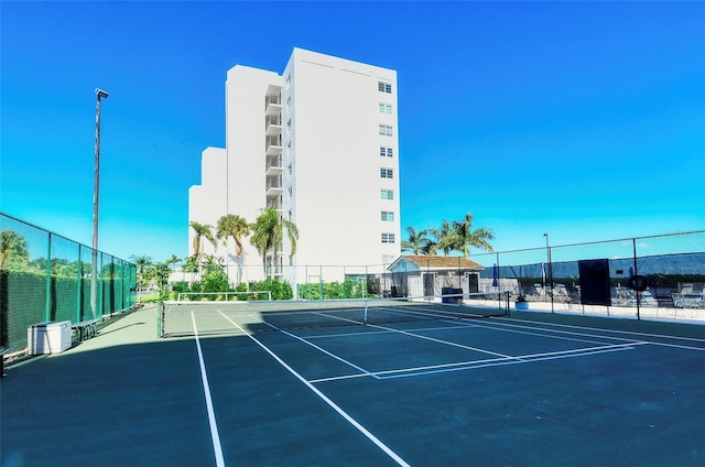 view of sport court with basketball hoop