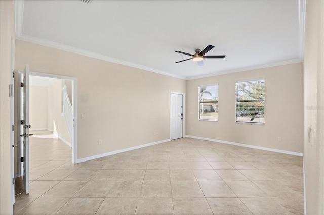 tiled spare room with crown molding and ceiling fan