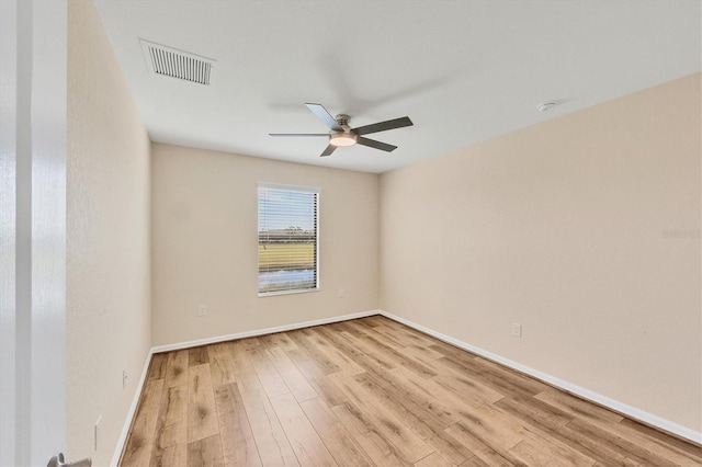 spare room featuring ceiling fan and light wood-type flooring