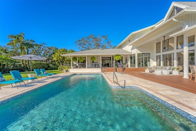 view of swimming pool featuring a wooden deck