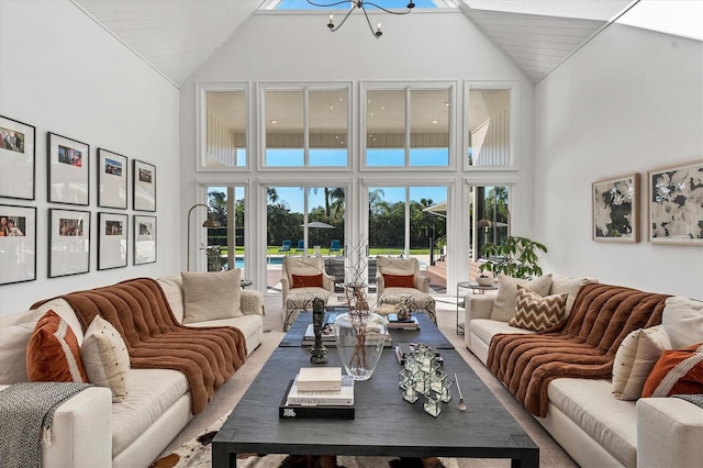 living room featuring a high ceiling and a chandelier