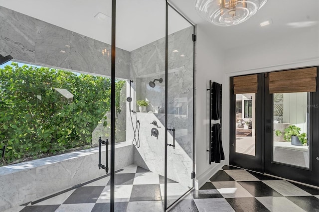 bathroom featuring plus walk in shower and french doors