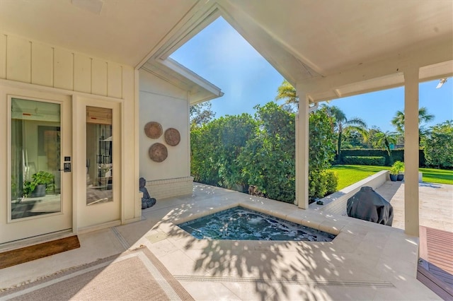 view of patio / terrace featuring a jacuzzi