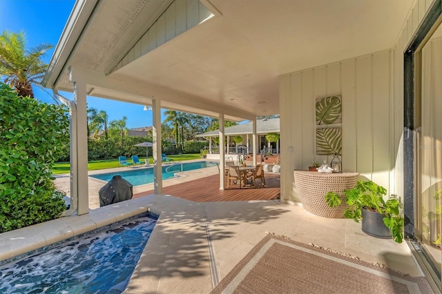 view of patio / terrace with a swimming pool side deck