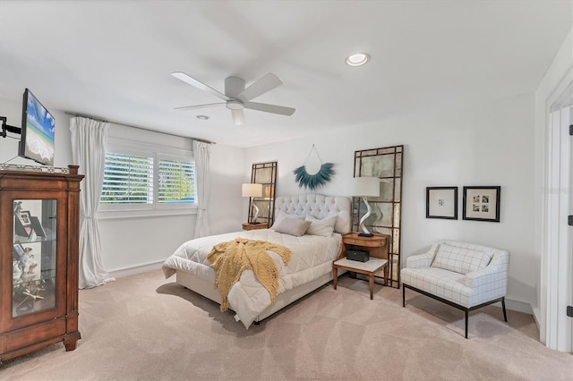 bedroom featuring ceiling fan and light colored carpet