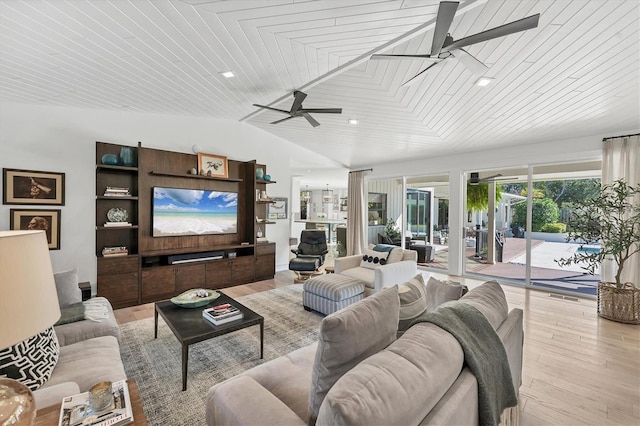 living room with wood ceiling, vaulted ceiling, ceiling fan, and light wood-type flooring