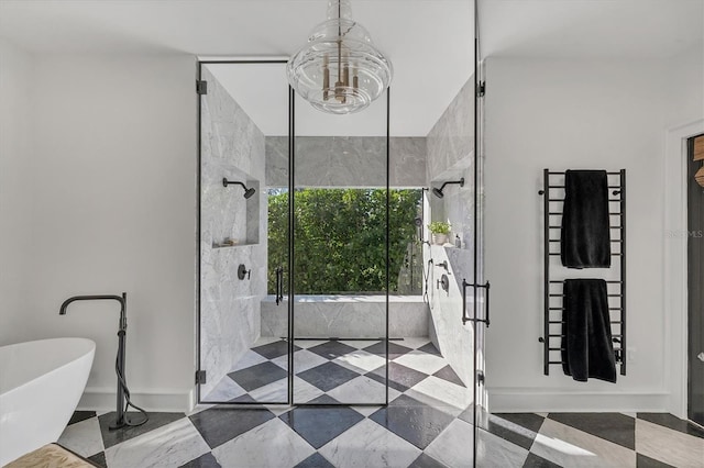 bathroom featuring a chandelier and independent shower and bath