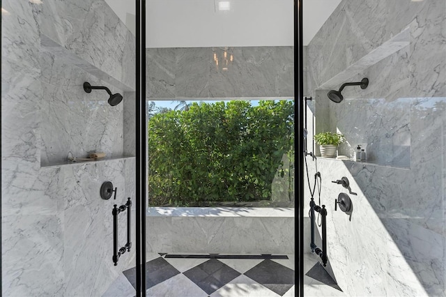 bathroom with a tile shower