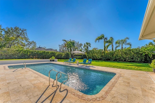 view of swimming pool with a gazebo, a patio, and a lawn