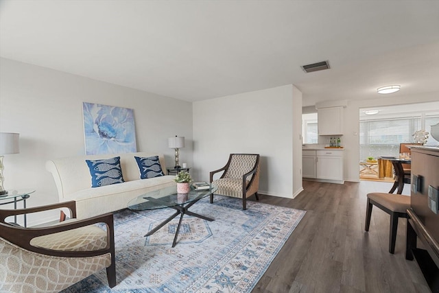 living room with dark wood-type flooring