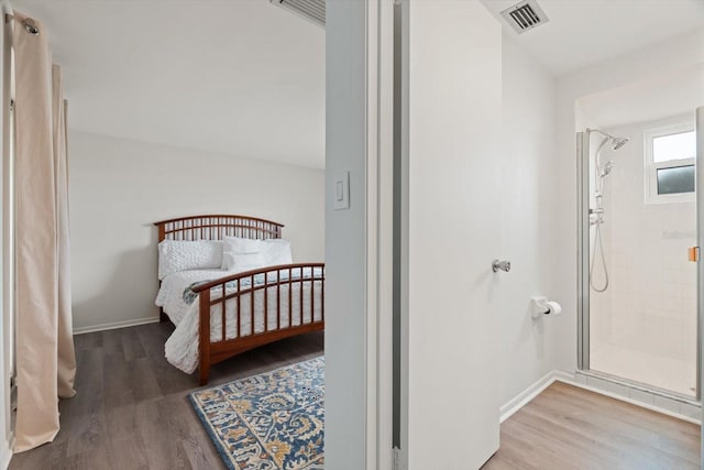 bedroom with hardwood / wood-style flooring