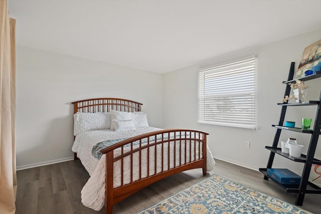 bedroom featuring dark hardwood / wood-style flooring