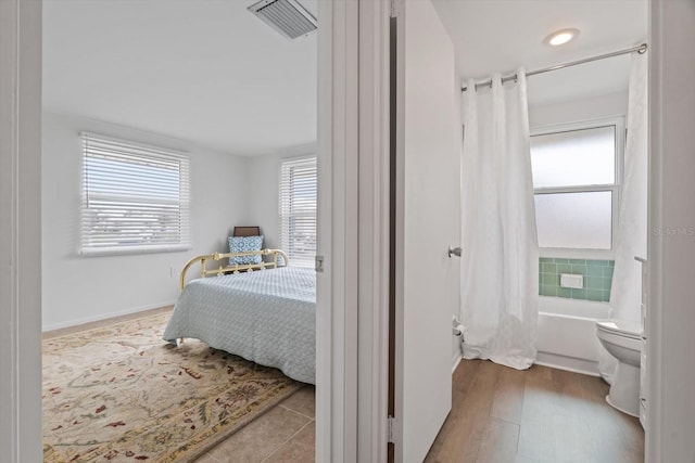 bedroom with light wood-type flooring