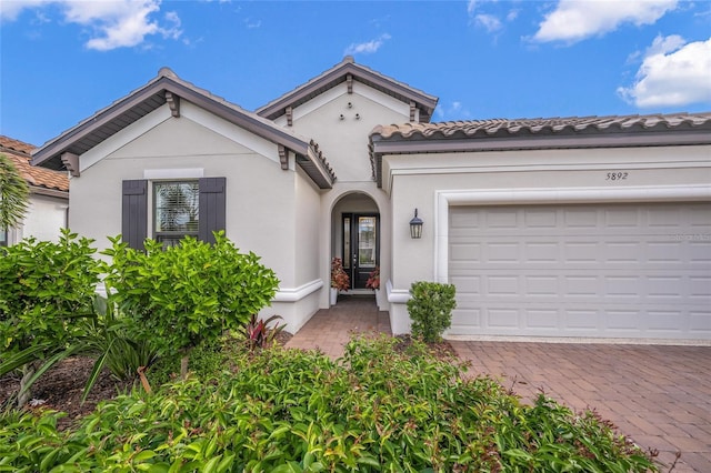 mediterranean / spanish-style house featuring a garage